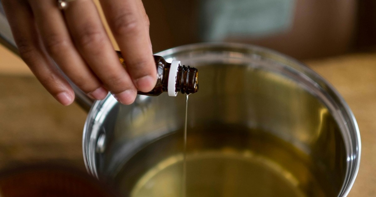 mixing the essential oils in a bowl